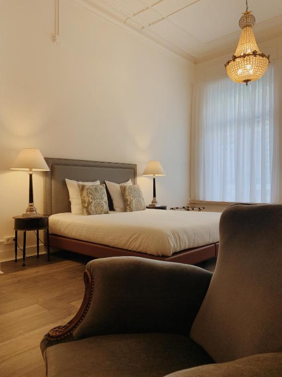 Postel nebo postele na pokoji v ubytování La Lys Rooms & Suites
