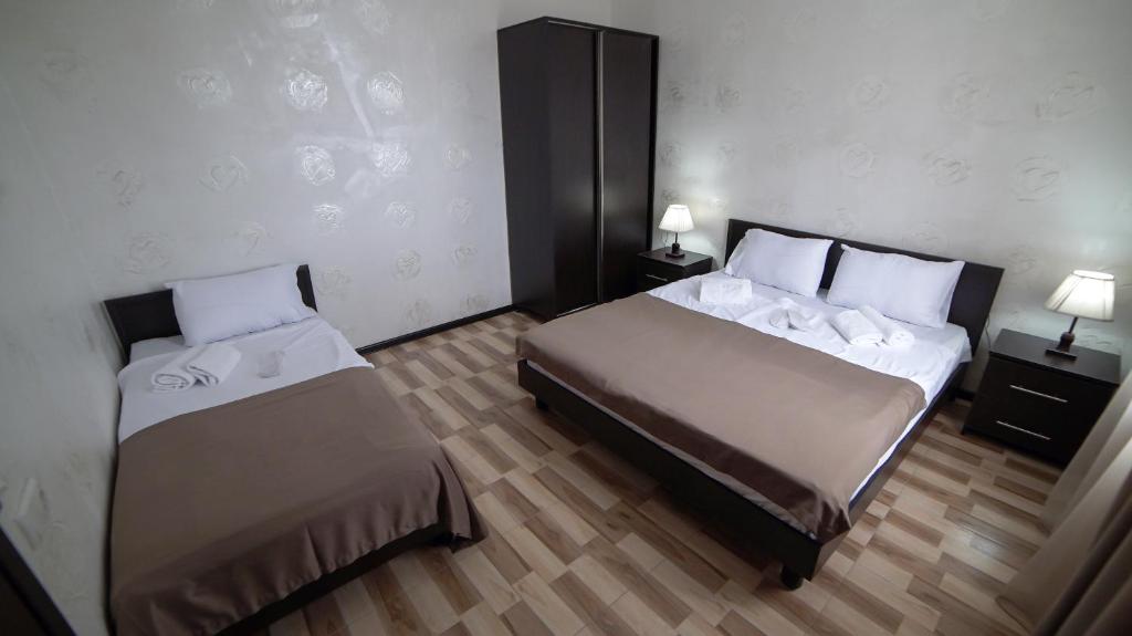 Postel nebo postele na pokoji v ubytování Hotel Progress