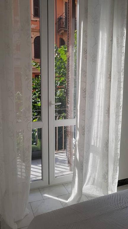 Łóżko lub łóżka w pokoju w obiekcie IL NIDO DELLA ZIA