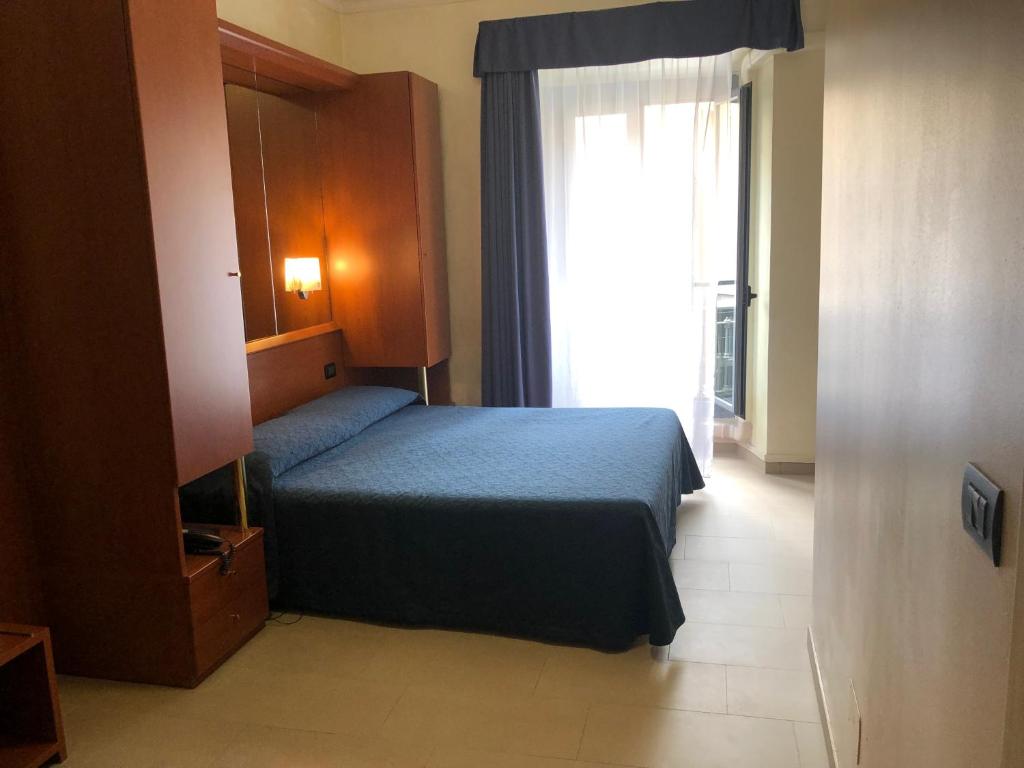 Postel nebo postele na pokoji v ubytování Hotel Aurora
