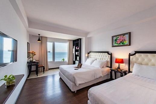 Postel nebo postele na pokoji v ubytování Bellevue Hotel