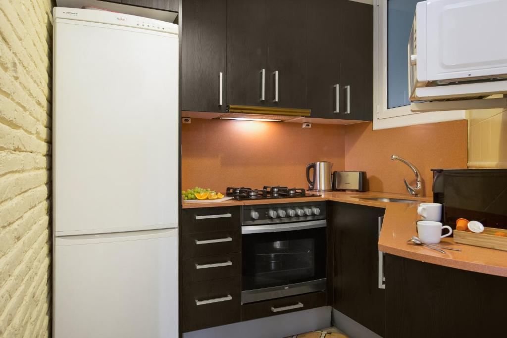 A kitchen or kitchenette at Stay U-nique Apartments Floridablanca