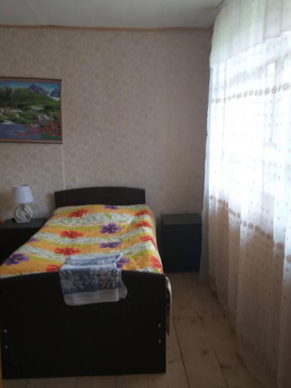 Postel nebo postele na pokoji v ubytování Jimsher Naveriani Guesthouse