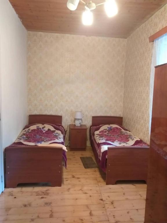 Postel nebo postele na pokoji v ubytování Jimsher Naveriani Guesthouse