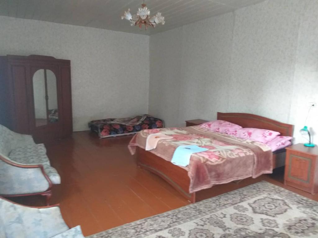 Postel nebo postele na pokoji v ubytování Jimsher Naveriani Guesthouse