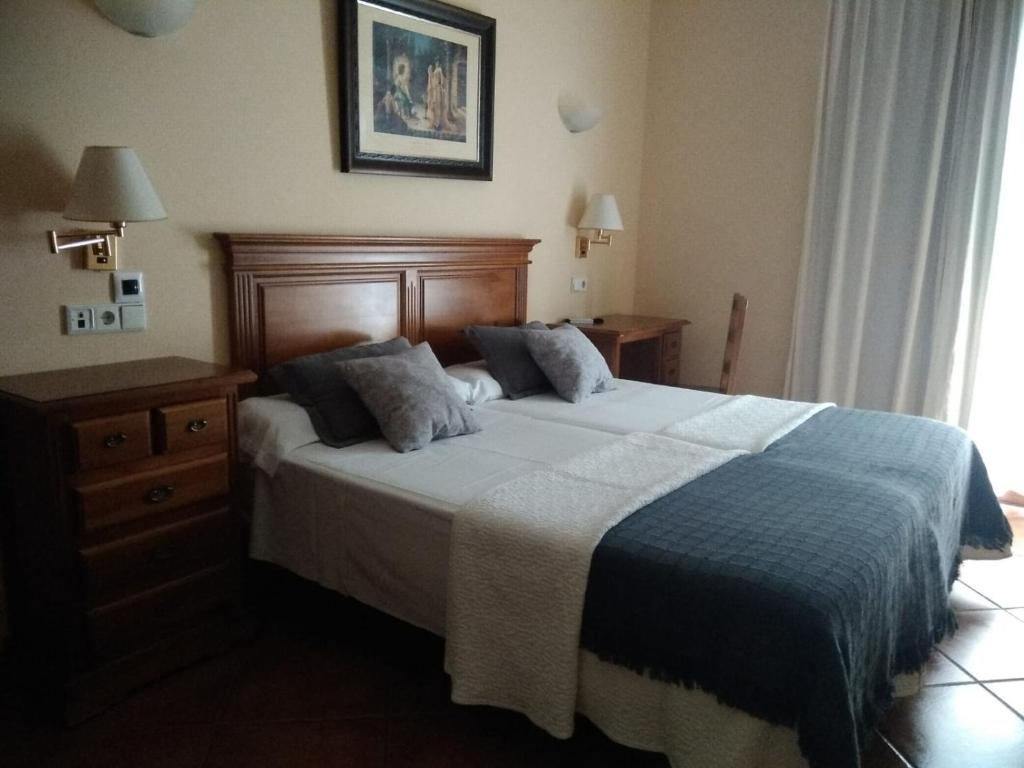 Postel nebo postele na pokoji v ubytování Hotel Plateros