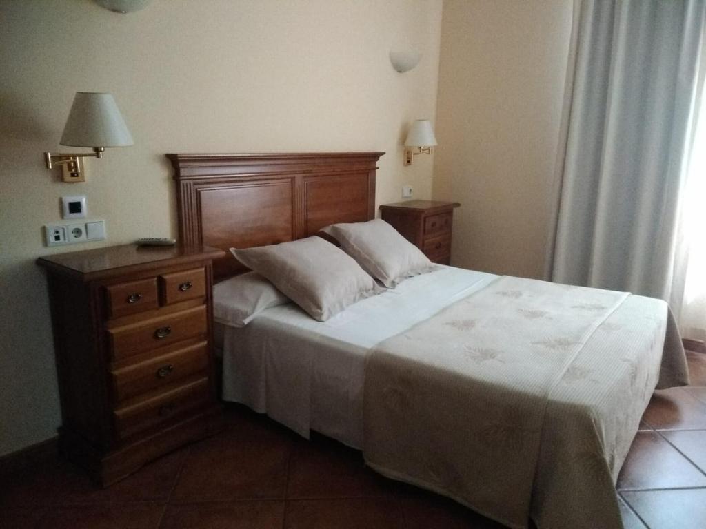 Postel nebo postele na pokoji v ubytování Hotel Plateros