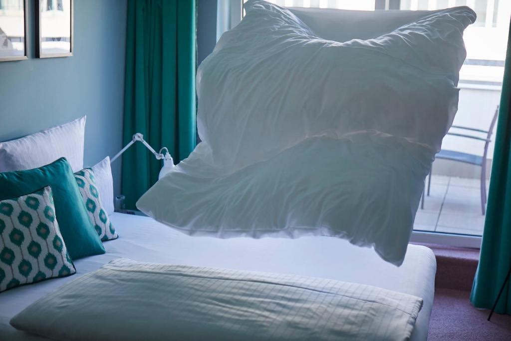 Postel nebo postele na pokoji v ubytování Hotel Metropol by Maier Privathotels
