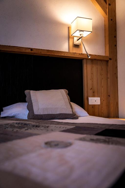 Postel nebo postele na pokoji v ubytování Hotel Le Littoral