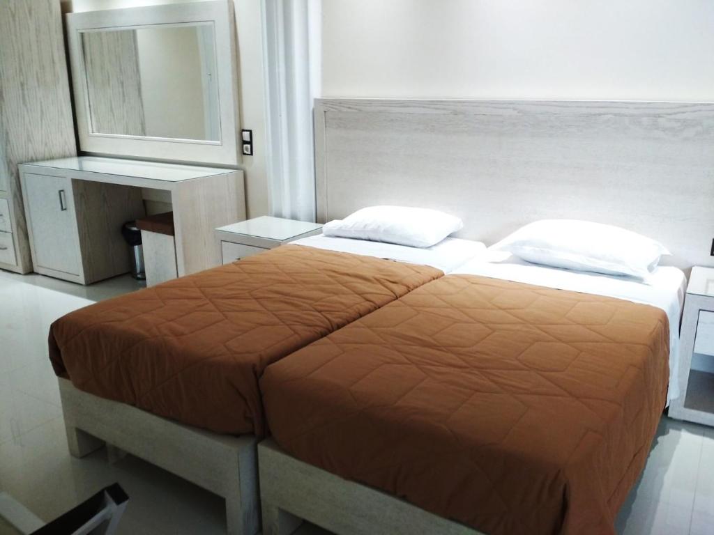 Postel nebo postele na pokoji v ubytování Mariana Hotel