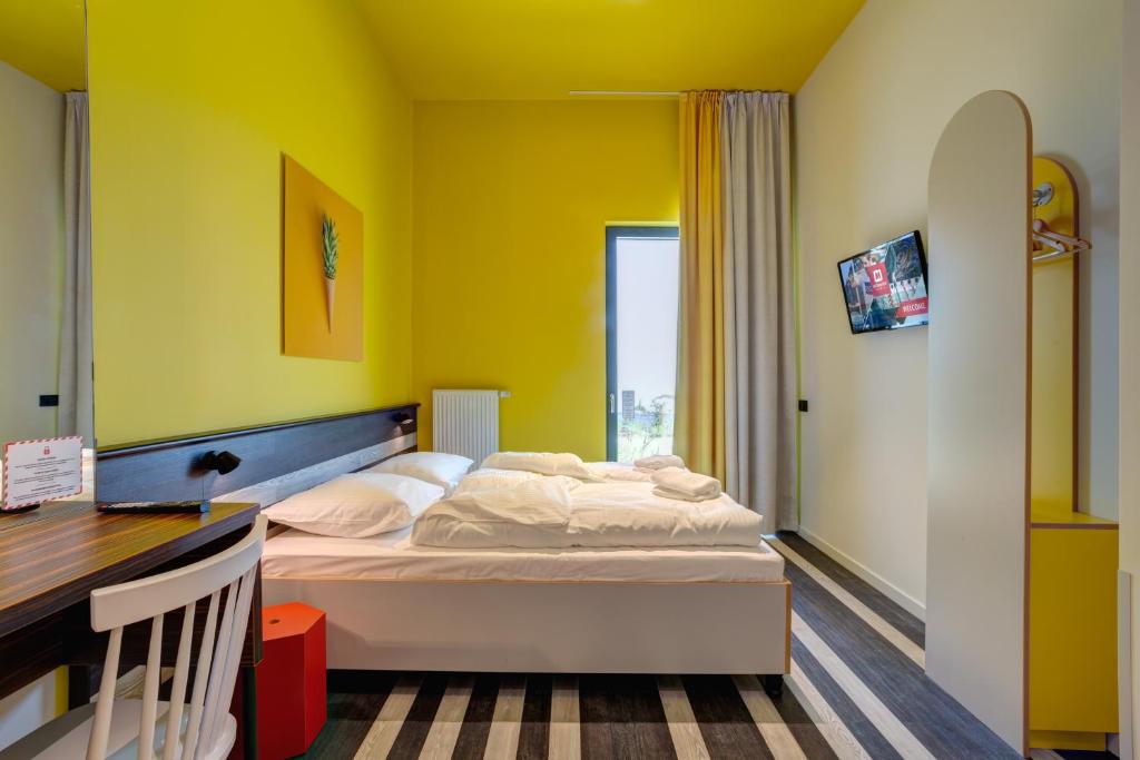 Postel nebo postele na pokoji v ubytování MEININGER Hotel Bruxelles Gare du Midi