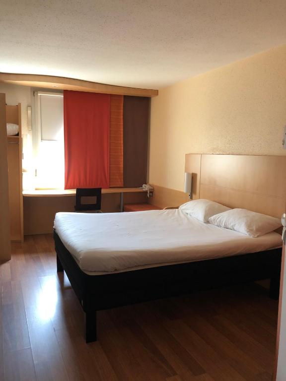 Postel nebo postele na pokoji v ubytování ibis Laon