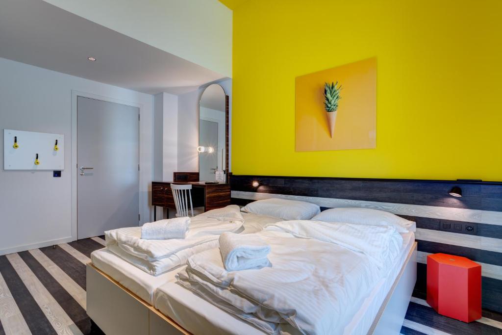 Postel nebo postele na pokoji v ubytování MEININGER Hotel Bruxelles Gare du Midi
