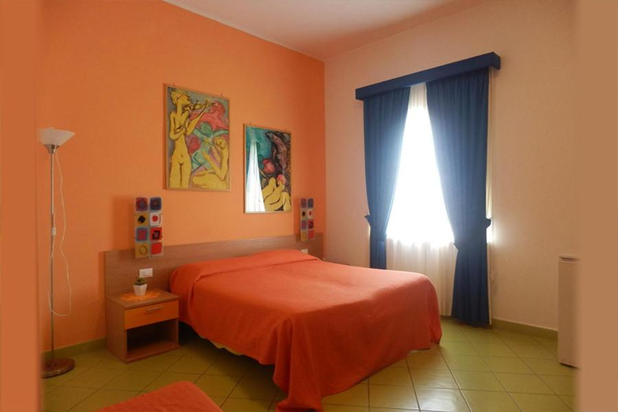 Postel nebo postele na pokoji v ubytování Alta Marea Sorrento