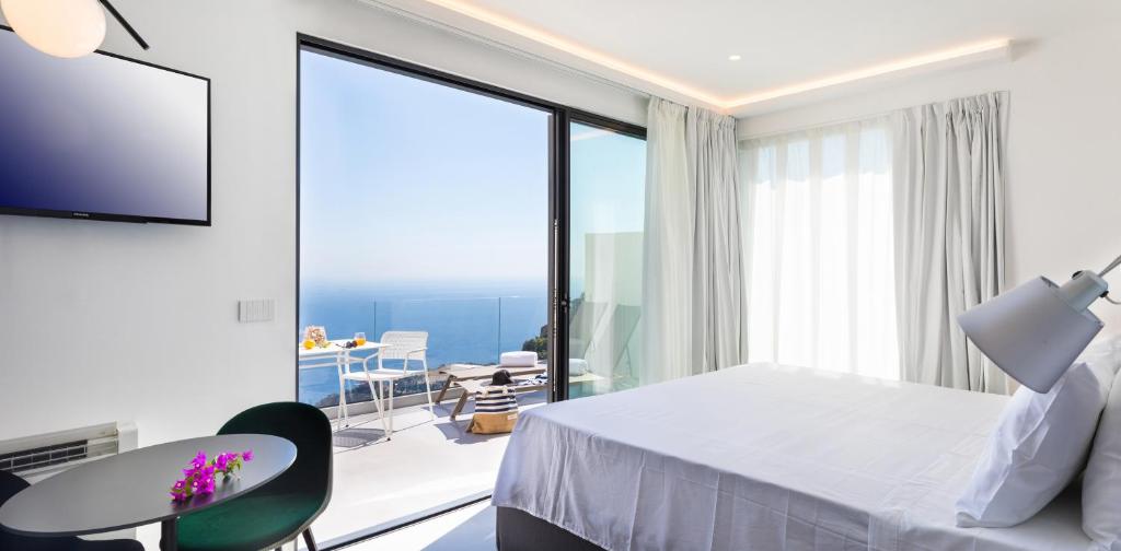 A television and/or entertainment centre at The View Luxury Apartments Taormina