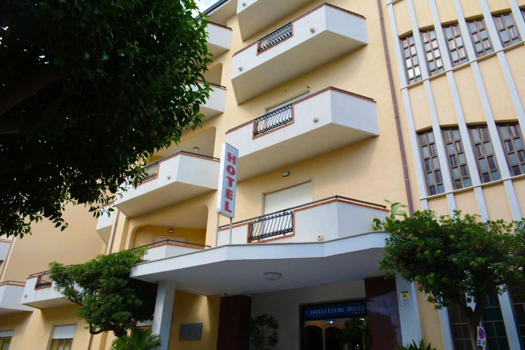 a building with balconies on the side of it at Castelvetere Hotel in Caulonia