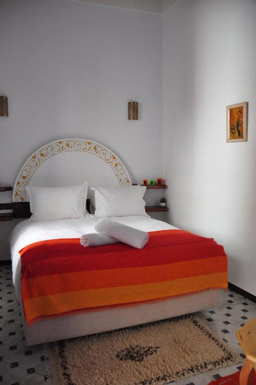 Кровать или кровати в номере Riad Zawia