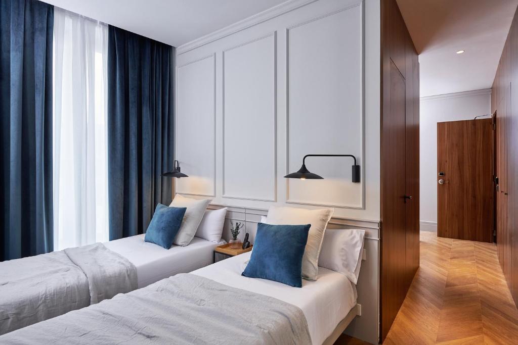 Postel nebo postele na pokoji v ubytování Helen Berger Boutique Hotel