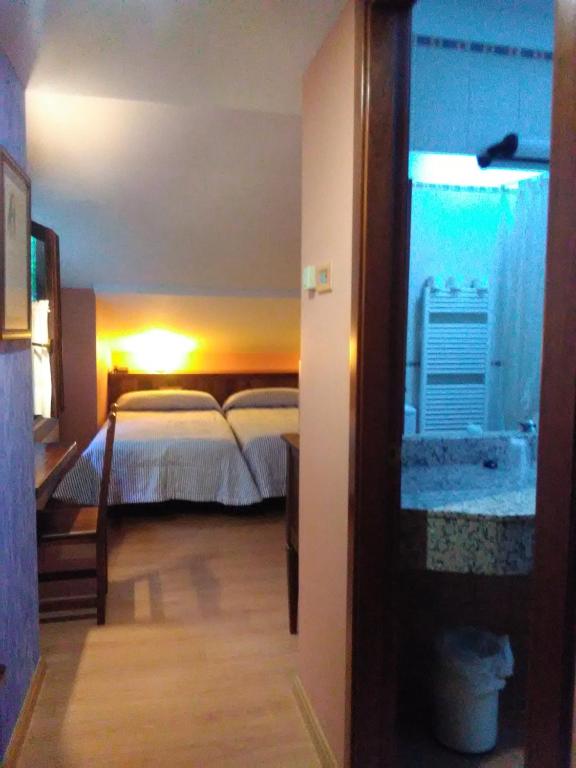 Postel nebo postele na pokoji v ubytování HOTEL TURPÍ