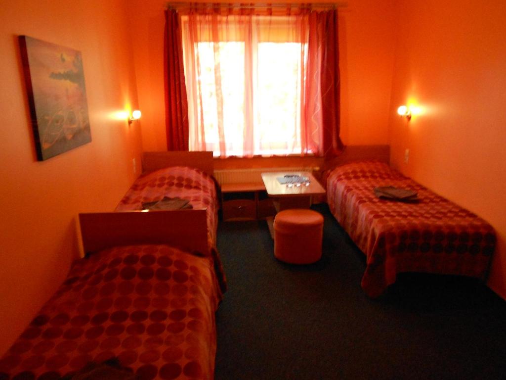 Postel nebo postele na pokoji v ubytování Jeruzale Hotel