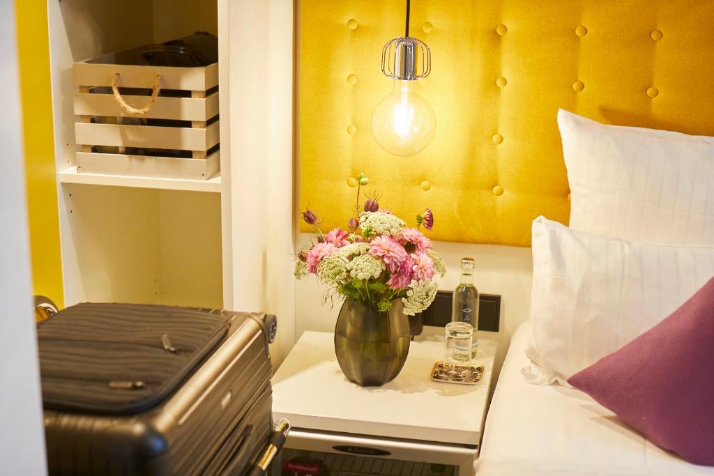 Postel nebo postele na pokoji v ubytování Hotel Mirabell by Maier Privathotels