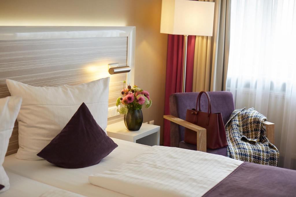 Postel nebo postele na pokoji v ubytování Hotel Mirabell by Maier Privathotels