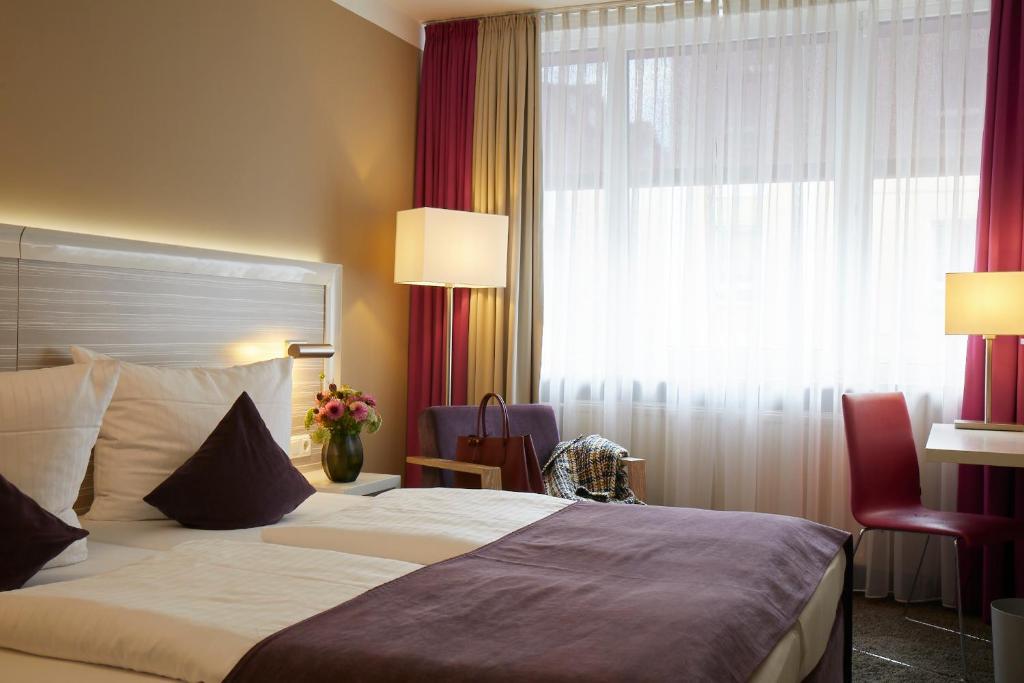 Postel nebo postele na pokoji v ubytování Hotel Mirabell by Maier Privathotels
