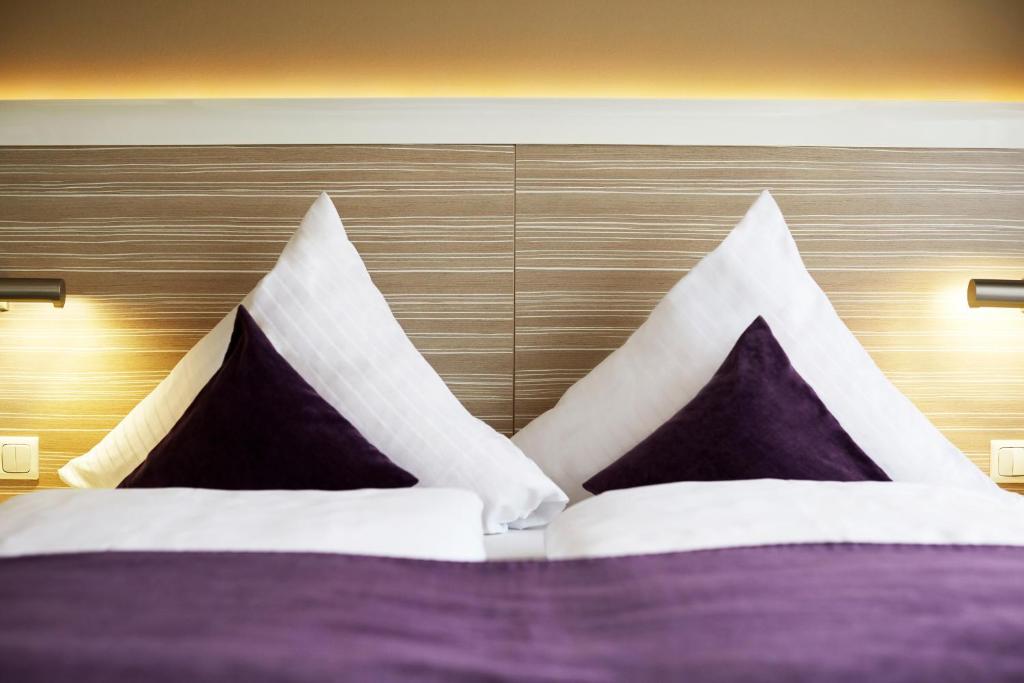 Postel nebo postele na pokoji v ubytování Hotel Mirabell by Maier Privathotels