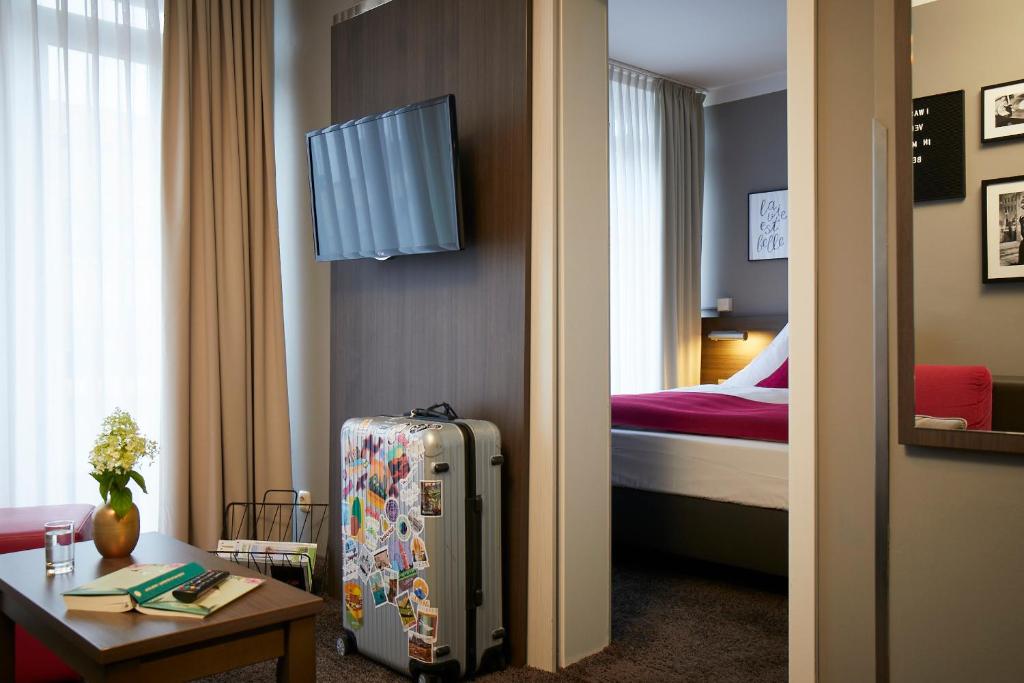 Postel nebo postele na pokoji v ubytování Hotel Mirabell by Maier Privathotels