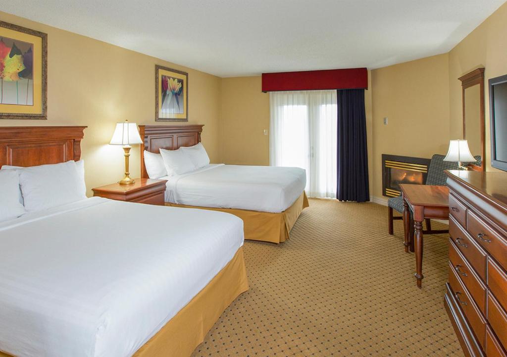 Кровать или кровати в номере Music Road Resort Hotel and Inn