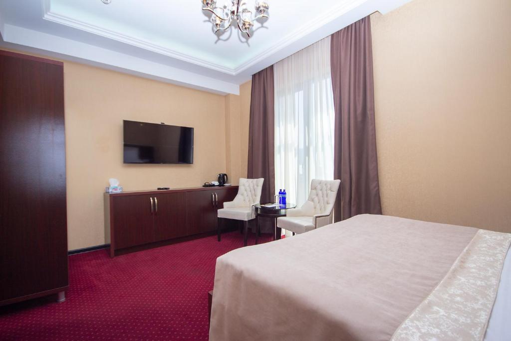 Televiisor ja/või meelelahutuskeskus majutusasutuses Marionn Hotel