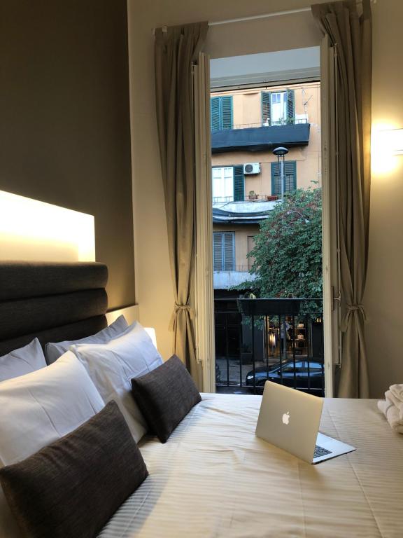 A bed or beds in a room at Residenze Chamur Via Giuseppe Sciuti
