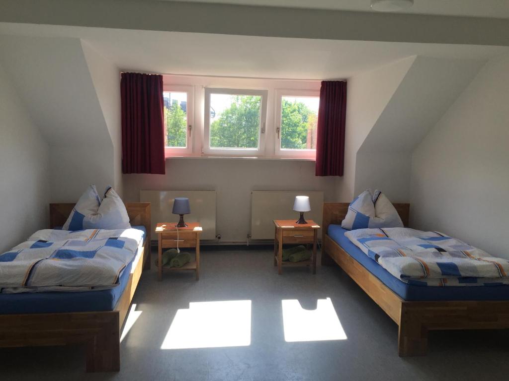 Postel nebo postele na pokoji v ubytování Gästehaus Sandra