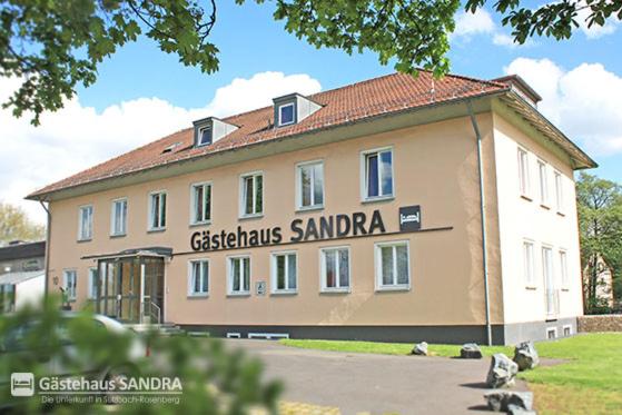 a large building with a sign on the side of it at Gästehaus Sandra in Sulzbach-Rosenberg