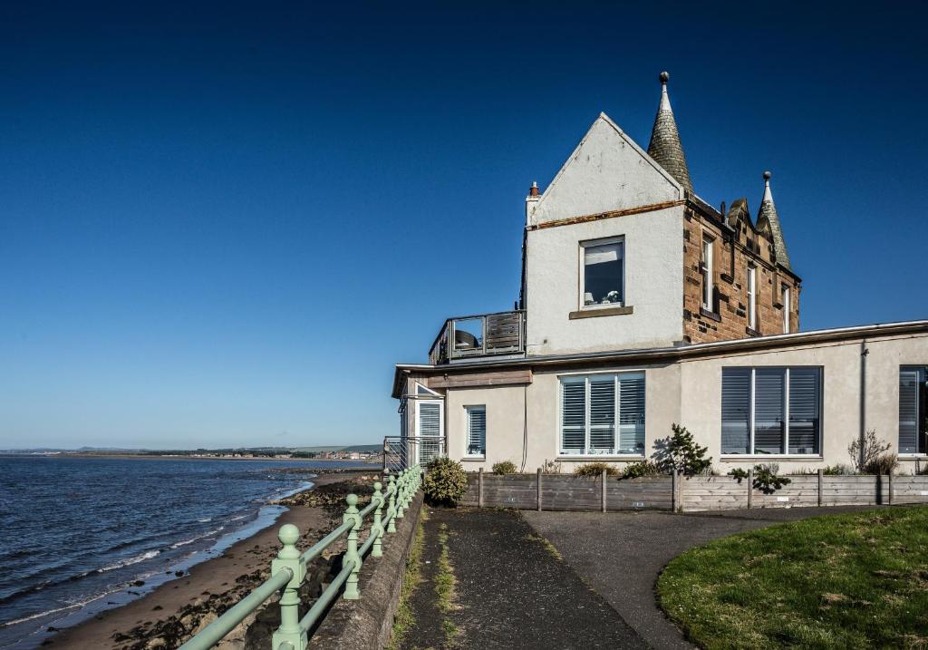 an old house on the shore of the water at Ark at Anchor in Edinburgh