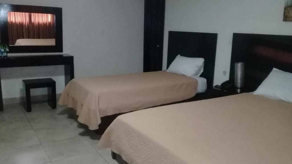 Postel nebo postele na pokoji v ubytování Hotel Terranova