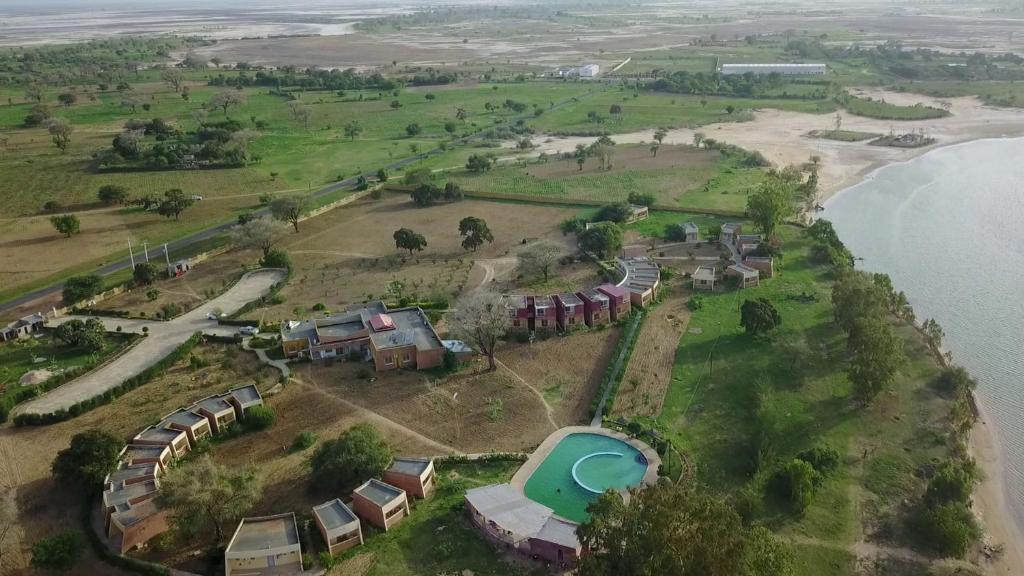 an aerial view of a resort complex next to the water at Hôtel Royal Malango in Fatick