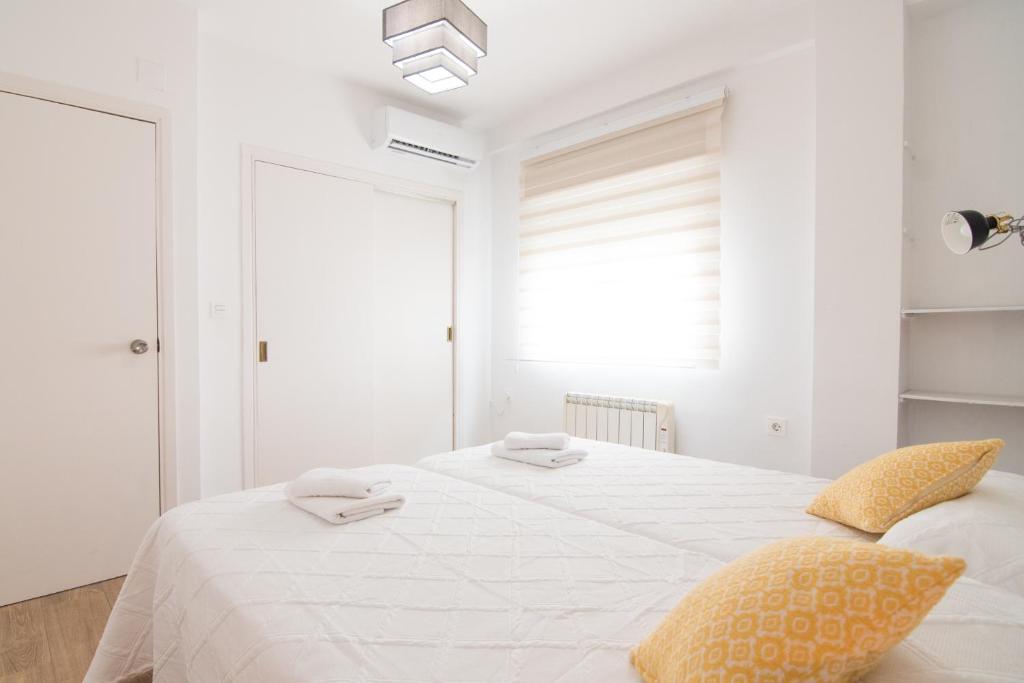 Postel nebo postele na pokoji v ubytování Lobos Apartment