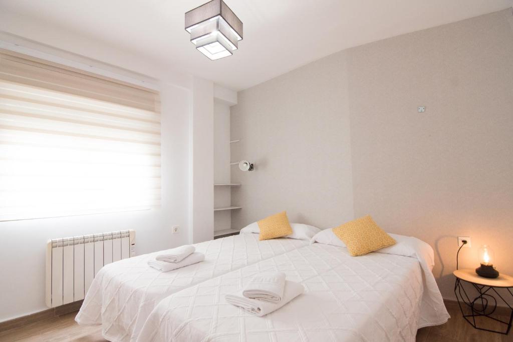 Postel nebo postele na pokoji v ubytování Lobos Apartment