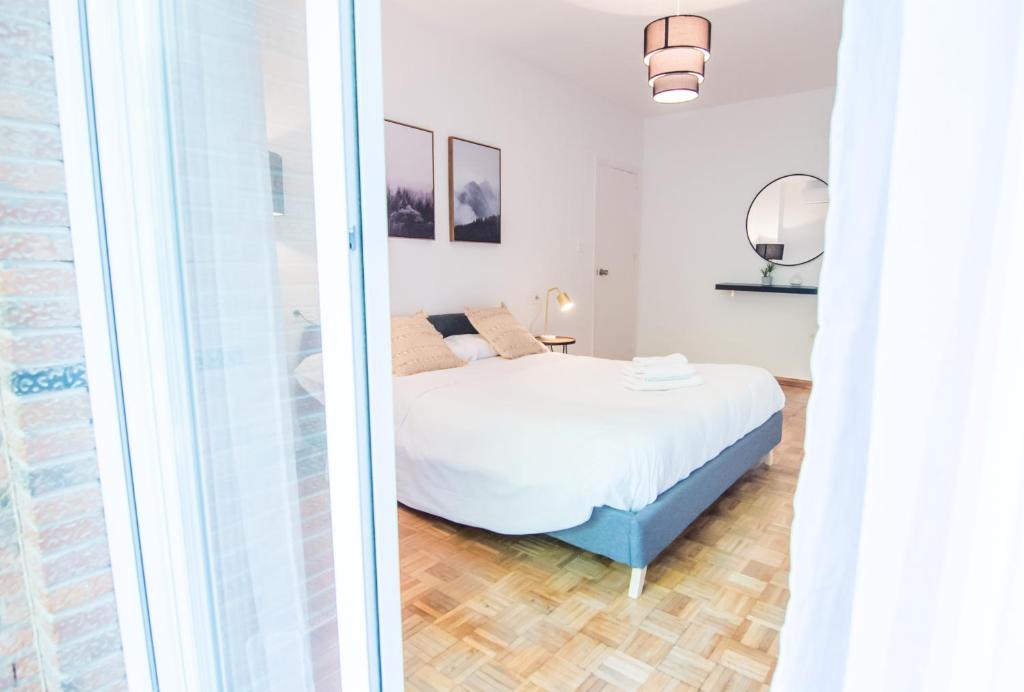 Postel nebo postele na pokoji v ubytování Lobos Apartment