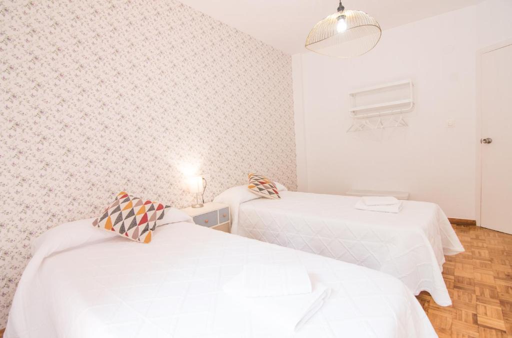 Postel nebo postele na pokoji v ubytování Lobos Apartment