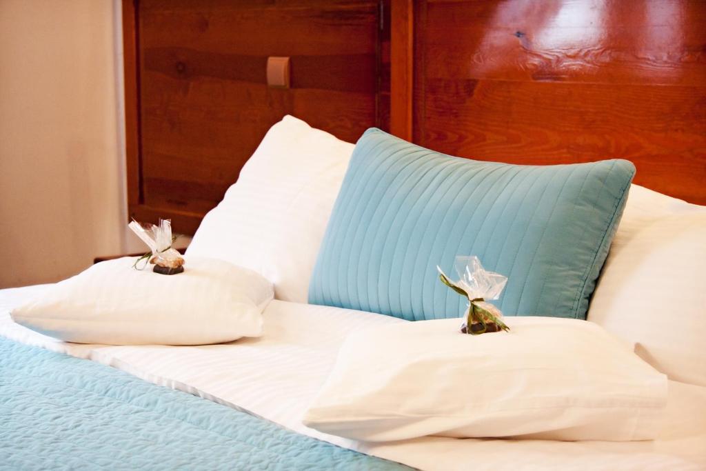 Postel nebo postele na pokoji v ubytování Hotel Pod Orłem