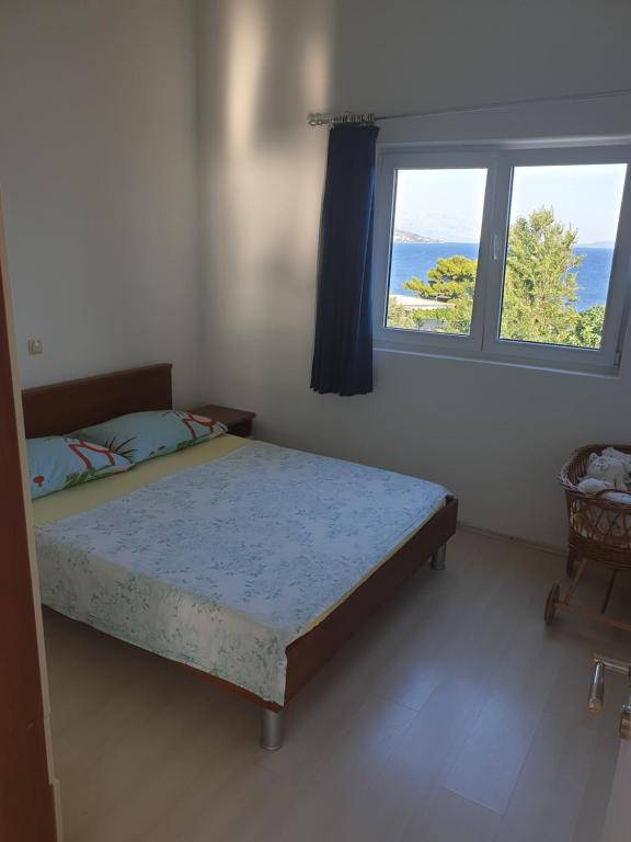 Posteľ alebo postele v izbe v ubytovaní Apartmani Mlikotić