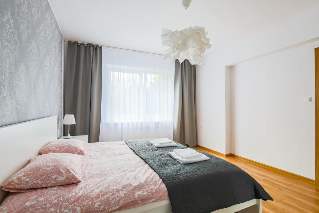 Posteľ alebo postele v izbe v ubytovaní Apartament Pod Winogronami