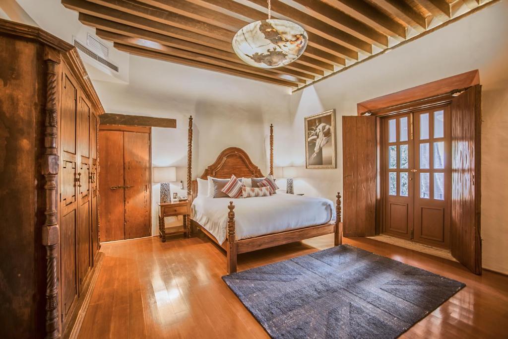 Кровать или кровати в номере Casona de los Sapos Hotel Boutique