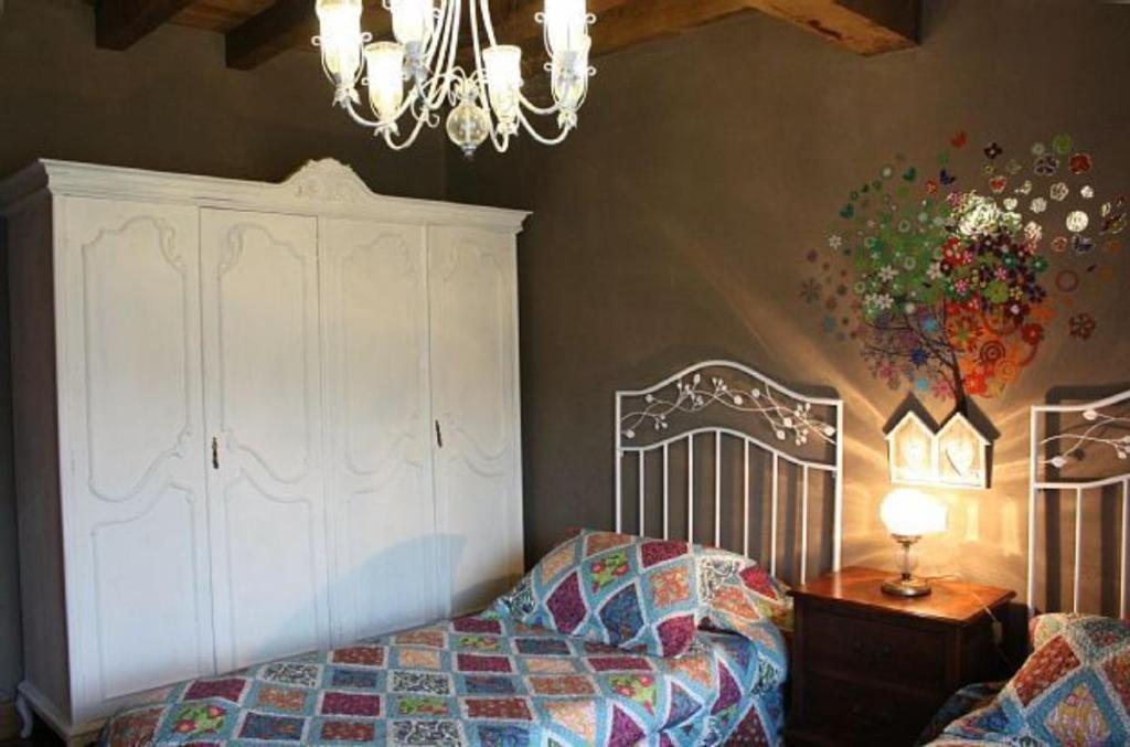 A bed or beds in a room at La Torre de San Esteban