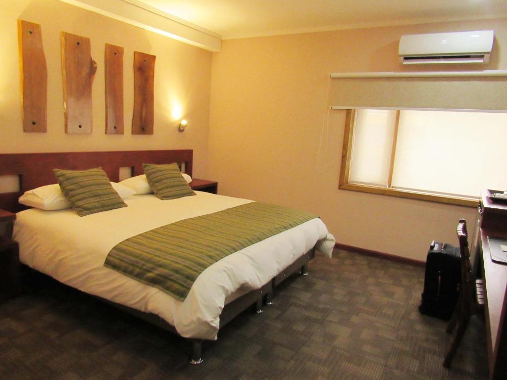 Cama o camas de una habitación en Hotel Pucón Indómito