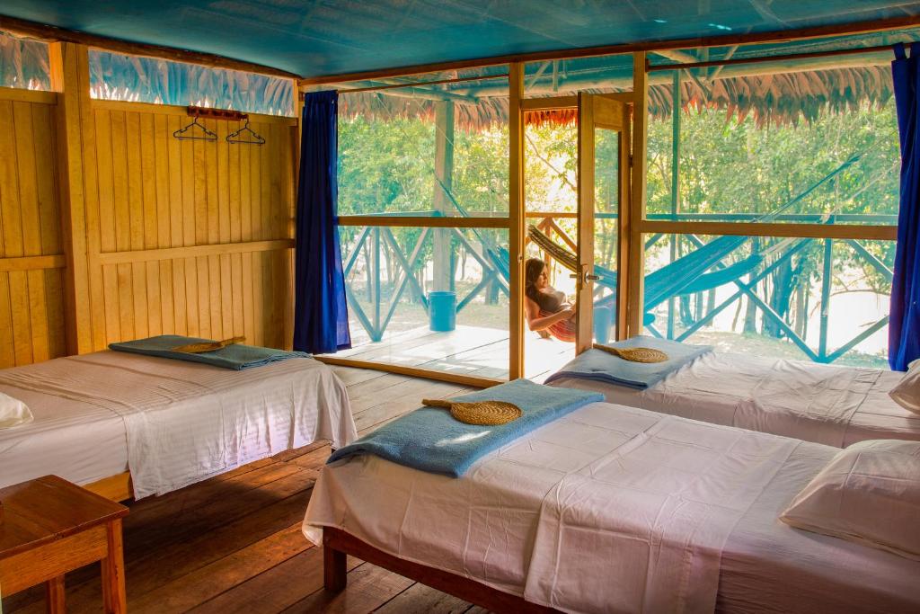 Postel nebo postele na pokoji v ubytování Amazon Muyuna Lodge - All Inclusive