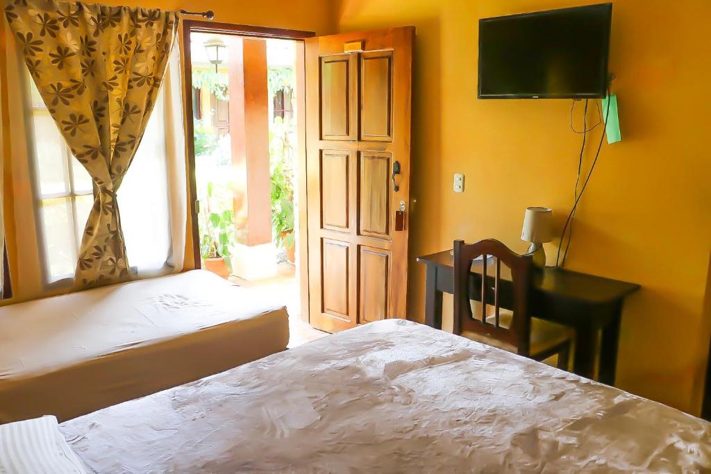 Postel nebo postele na pokoji v ubytování Posada Gema de Copan
