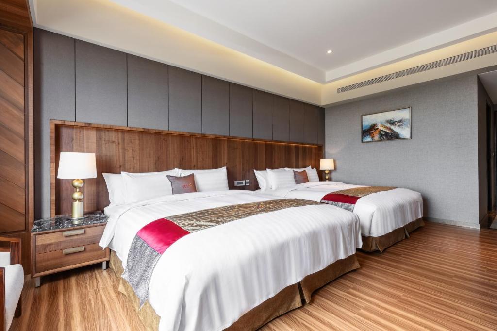 Postel nebo postele na pokoji v ubytování Chuang-tang Spring Spa Hotel